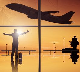 Silhouettes Of Businessan and Airplane In Airport