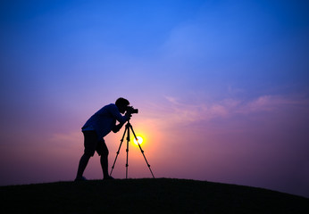 Silhouette of Photographer on Hill Top