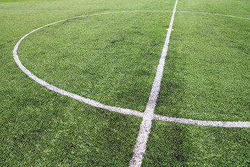 Obraz premium White stripe on the green soccer field