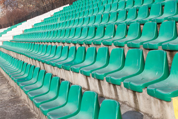 Obraz premium empty plastic seats on football stadium