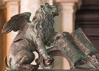 Venice - Lion bronze statue on gate of bell tower