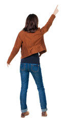 Back view of  pointing woman.