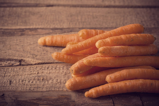 Organic Carrots on wooden background