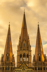 Fototapeta na wymiar Golden glow on St Paul's Cathedral in Melbourne