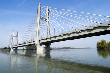 Fototapeta na wymiar Cable-stayed bridge across river Po in Northern Italy