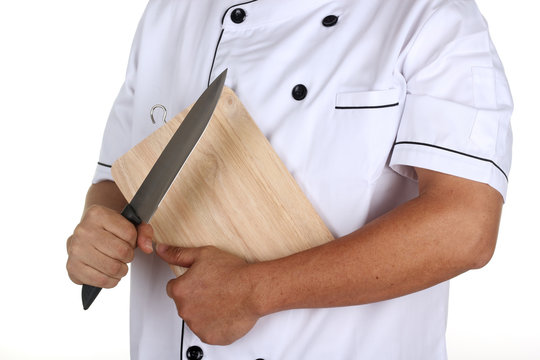 Chef Holding The Wooden Block And Knife