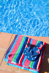towel and sandals near pool