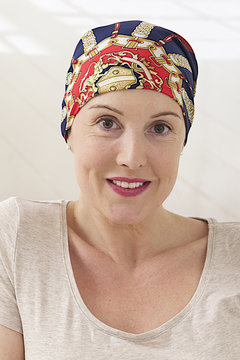 woman with headscarf after cancer treatment