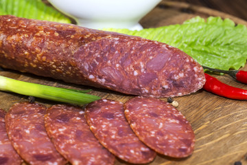 sausage on a wooden plate in a restaurant