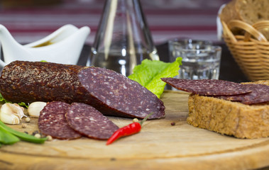 sausage on a wooden plate in a restaurant