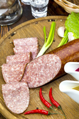 sausage on a wooden plate in a restaurant