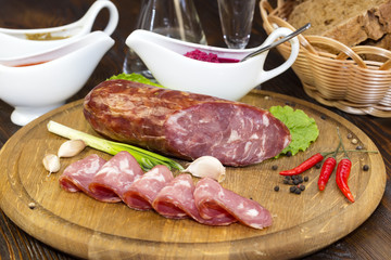 sausage on a wooden plate in a restaurant