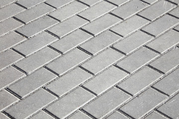 gray paving stones on the sidewalk