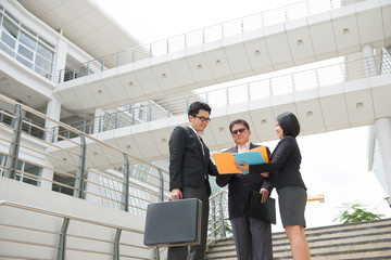 asian business team stand up meeting