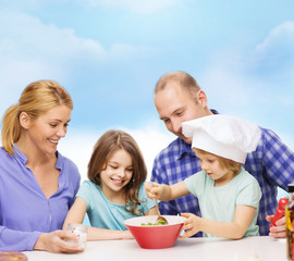 happy family with two kids eating at home