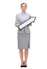 smiling businesswoman with direction arrow sign