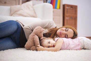 Little nap during the day for tired mother and baby .