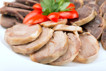 Meat roulade with tomato and parsley close up