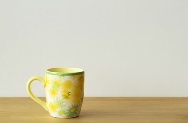 Mug/cup on wood table and white background