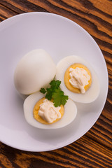 Deviled eggs with parsley in a plate