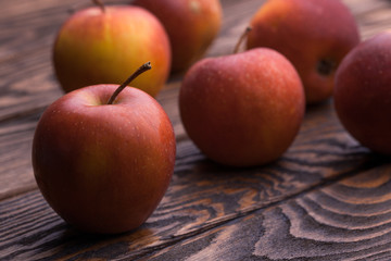 red apples on wooden table, selective focus