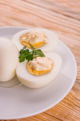 Deviled eggs with parsley in a plate