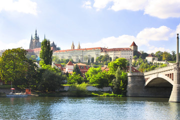 Fototapeta na wymiar Vitava river and St. Vitus Cathedral in Prague