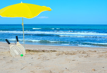 rackets and parasol