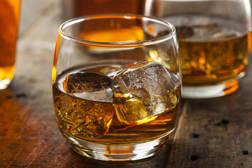 Alcoholic Whiskey Bourbon in a Glass with Ice