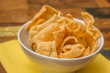 Traditional chinese prawn crackers in white bowl