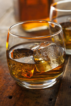 Alcoholic Whiskey Bourbon in a Glass with Ice