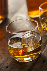 Alcoholic Whiskey Bourbon in a Glass with Ice
