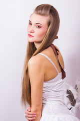 Fototapeta premium Portrait of a beautiful young woman with long hair