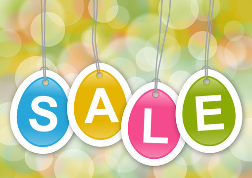 Bunte, eif&ouml;rmige Anh&auml;nger mit Text SALE vor Bokeh-Hintergrund
