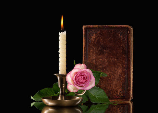 Fototapeta candle light  with flower on black background