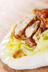 Salad plate with grilled meat.