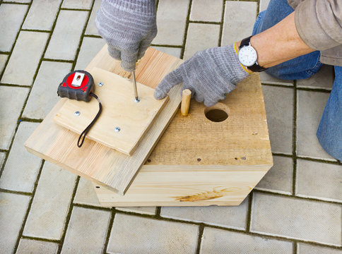 Making  birdhouse from boards