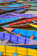 Fototapeta na wymiar Detail of old colorful sail boats in the lake