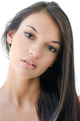 Fototapeta premium Portrait of a beautiful brunette girl with long hair.