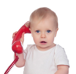Beautiful baby with a red phone