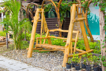 Fototapeta na wymiar wood swing in the garden