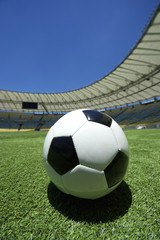 Football Soccer Ball on Green Grass Stadium Pitch