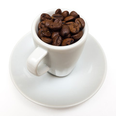 Cup with coffee beans on a white background