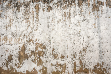 concrete texture of old stone wall with a crack