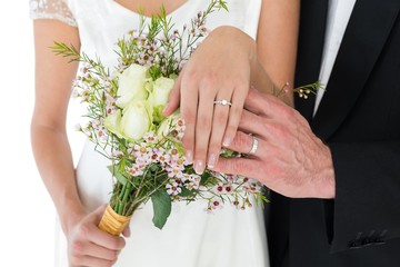 Newly wed couple showing wedding rings