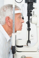 Senior man getting his cornea checked