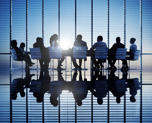 Silhouettes Of Business People In A Conference Room