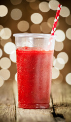Glass of delicious cold strawberry smoothie