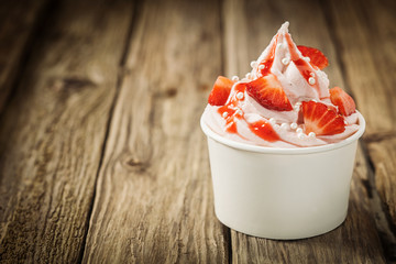 Ripe red strawberries and frozen yogurt
