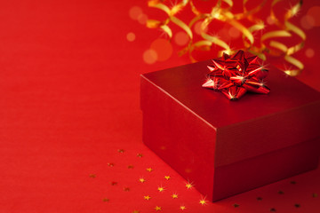 Christmas red gift box with glossy ribbon